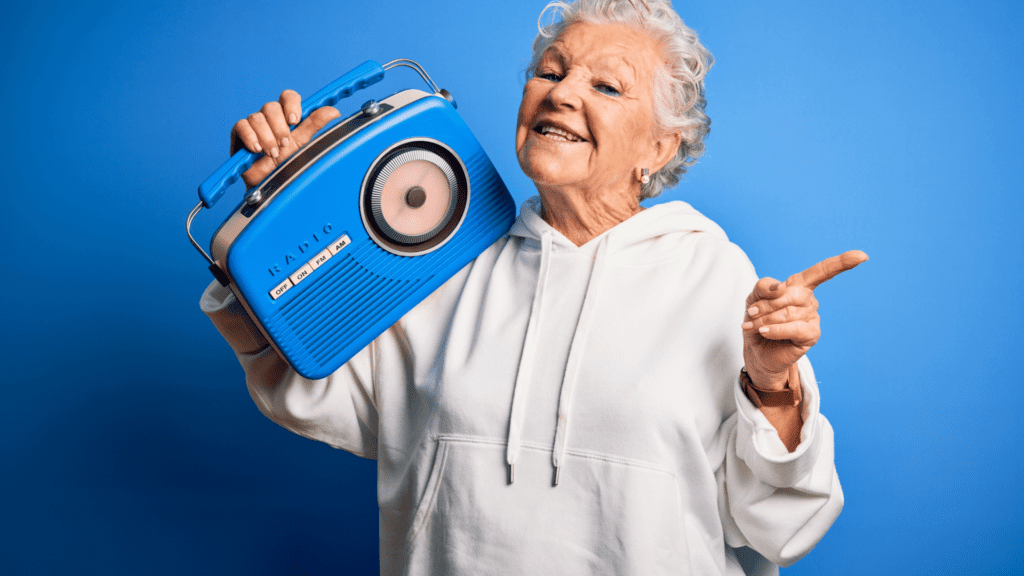 older woman holding radio