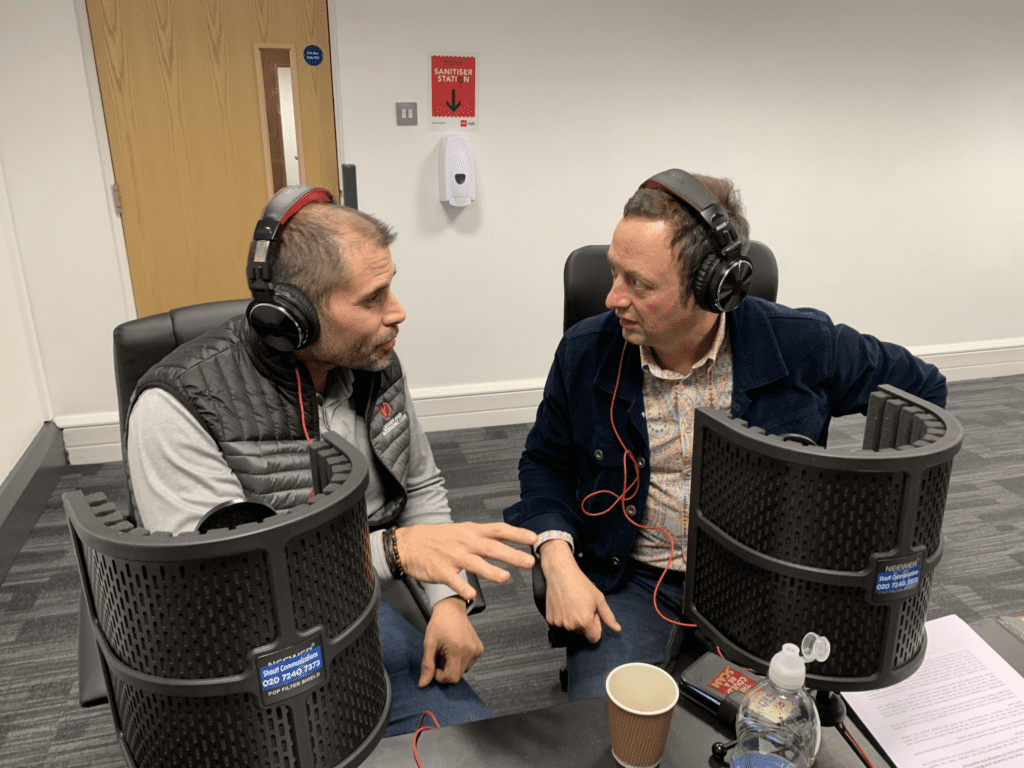 two men in a portable radio studio